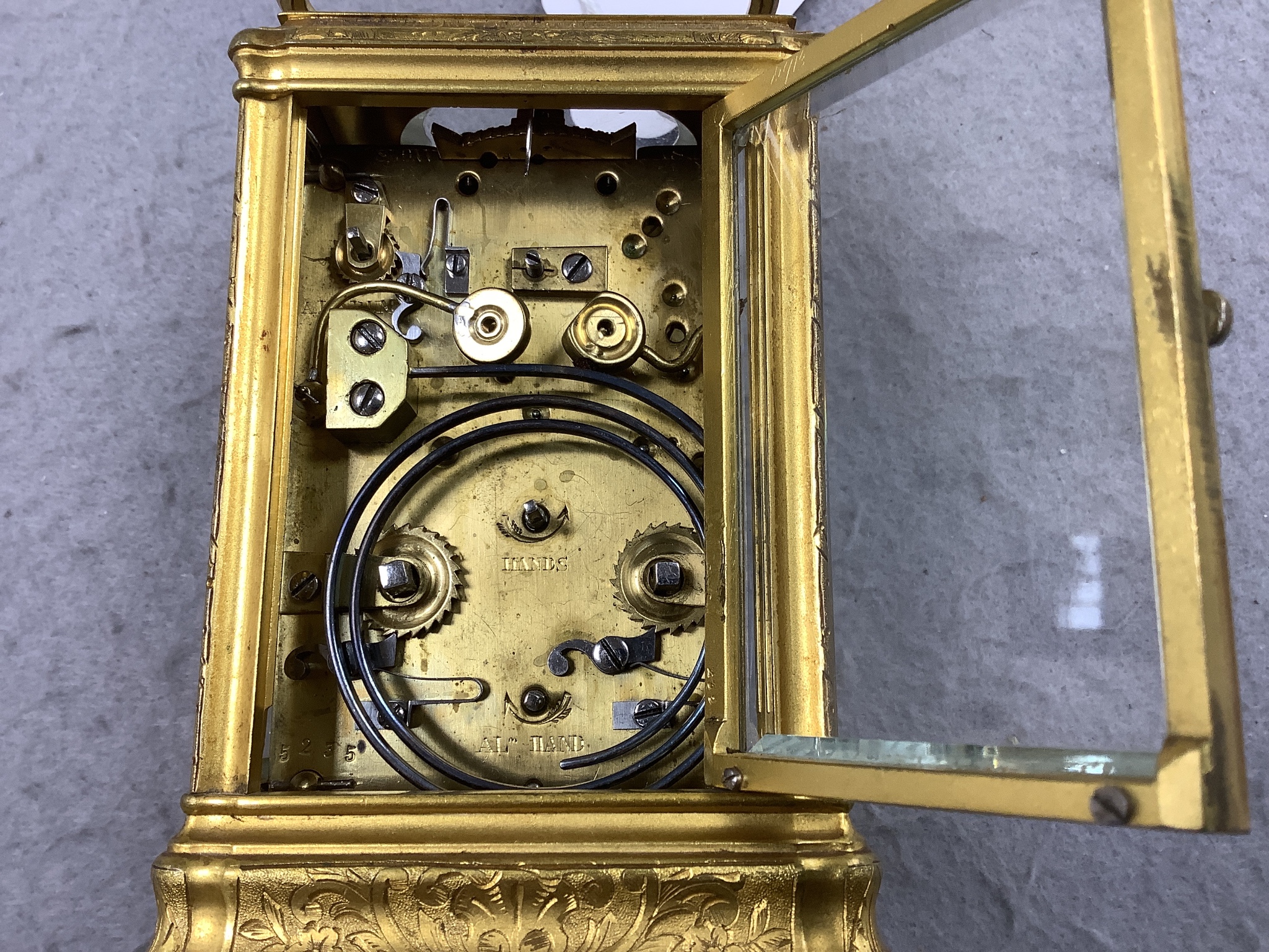 A late 19th century French engraved gilt brass gorge-cased repeating carriage clock with alarm, width 7.5cm depth 6.5cm height 11.5cm